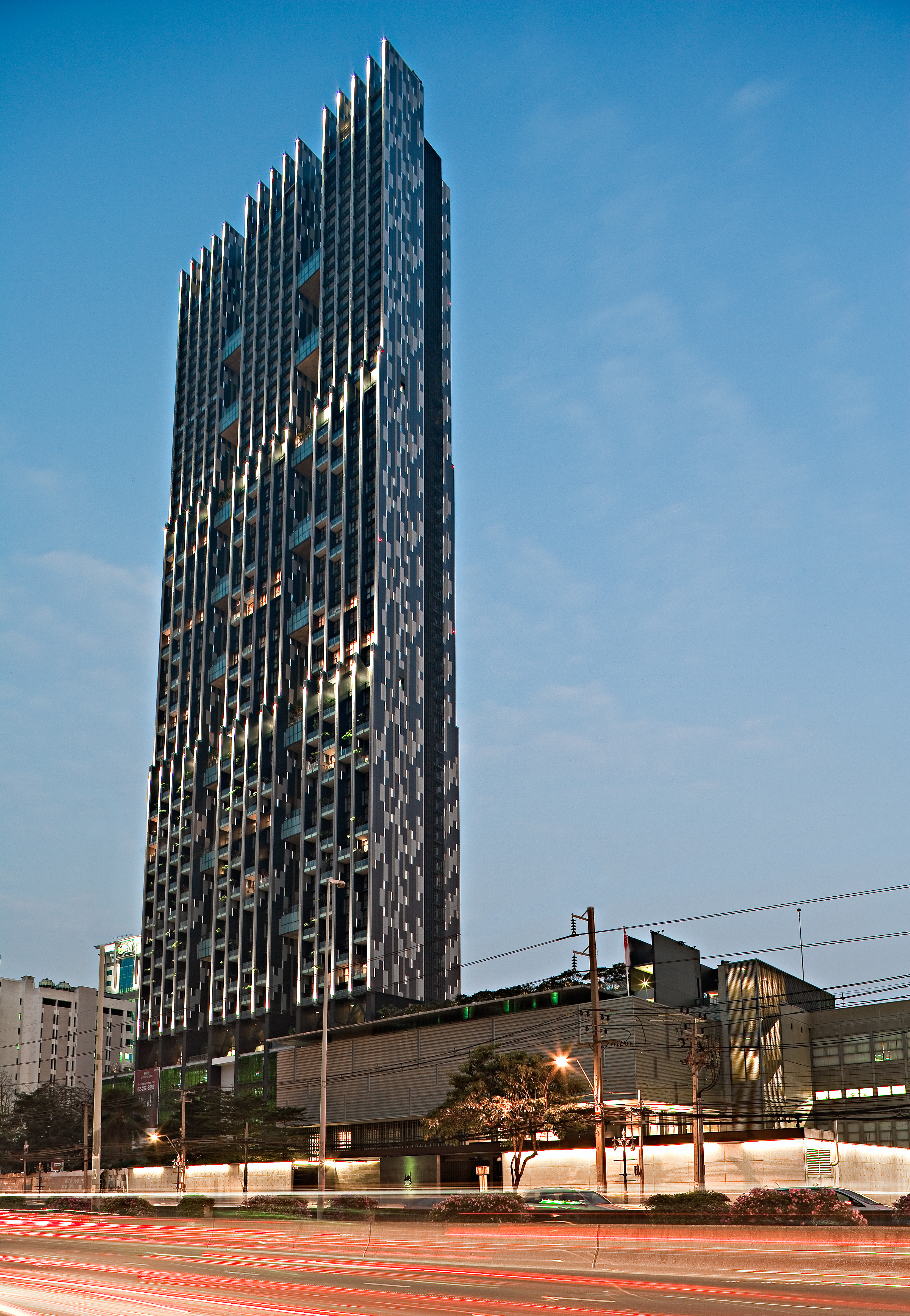 The Met Sathorn tower exterior at dusk from South Sathorn Road